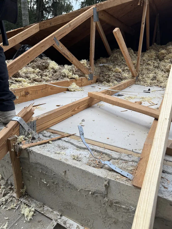 New structural framing installed during tree damage roof restoration